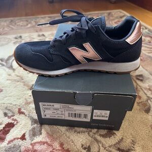 New Balance Woman’s Navy Blue and Gold Sneakers